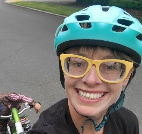 A photo of Anna Zivarts biking.